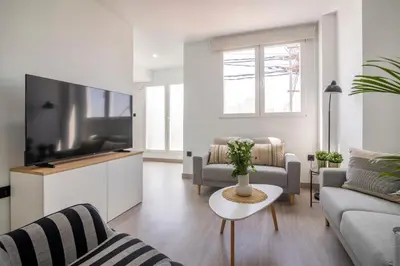 a living room with a large flat screen tv at SingularStays Santa Clara II in Valencia