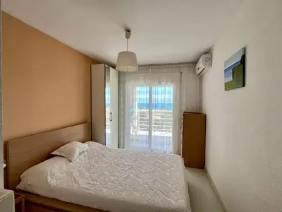 a bedroom with a bed and a window at Panorama Azul Apartment in El Puig