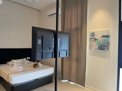 a bedroom with a bed with a black pole at Osito Hub - Campoamor in Valencia