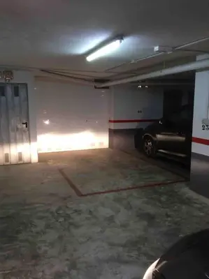 a parking garage with a car parked in it at Appartement Tavernes de la Valldigna 4p in Valencia