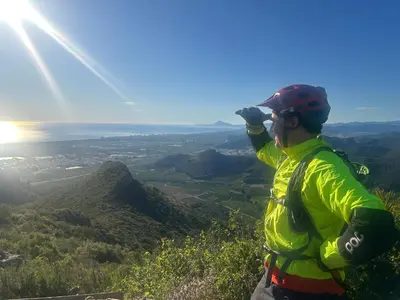 a man is looking at the view from a mountain at Appartement Tavernes de la Valldigna 4p in Valencia