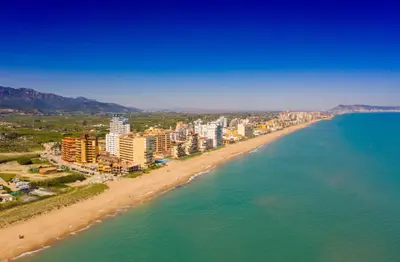 an aerial view of a beach with buildings and the ocean at Appartement Tavernes de la Valldigna 4p in Valencia