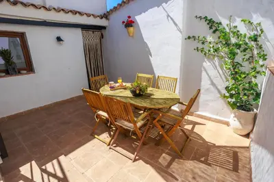 a table and chairs on a patio at Villa Valeria, Casa con Cueva privada del 1748 in Requena