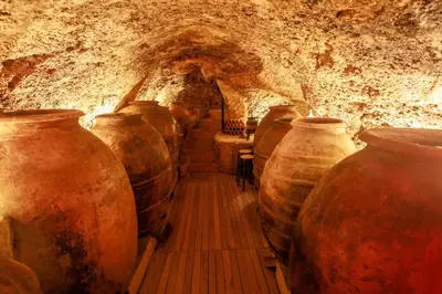 a row of large vases lined up in a cave at Villa Valeria, Casa con Cueva privada del 1748 in Requena