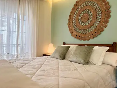a small bedroom with a bed and a window at A R Benjamín in Artana