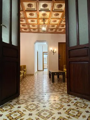 an entrance to a house with a door and flowers at A R Benjamín in Artana