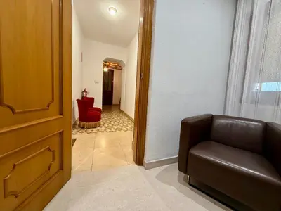 a walk in closet with a bed and towels at A R Benjamín in Artana