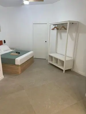 a bedroom with a bed and a closet and a tiled floor at Galdós Flats by Vivo GC in Valencia