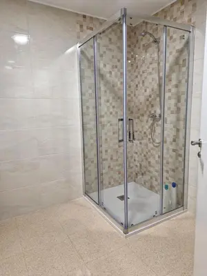 a shower with a glass enclosure in a bathroom at VIVIENDA La MERCED in El Puig
