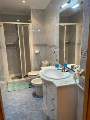 a bathroom with a sink and a toilet and a shower at Casa JUANES in Cullera