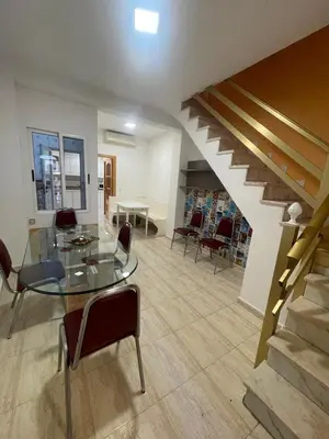 a dining room with a glass table and chairs at Casa JUANES in Cullera