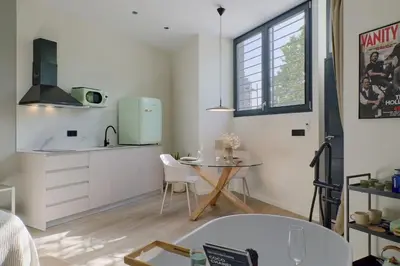 a kitchen with a small table and a small table at Romantic Apartment N2 Oceanografico Virkin Suites in Valencia