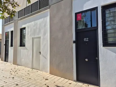 a black door on the side of a building at Romantic Apartment N2 Oceanografico Virkin Suites in Valencia