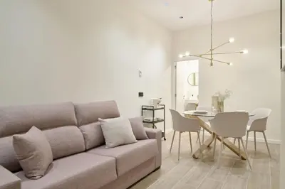 a living room with a couch and a table at Romantic Apartment N3 Oceanografico Virkin Suites in Valencia