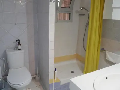 a bathroom with a toilet and a shower and a sink at HAWAI, Esc-3, 3-16 in Faro de Cullera