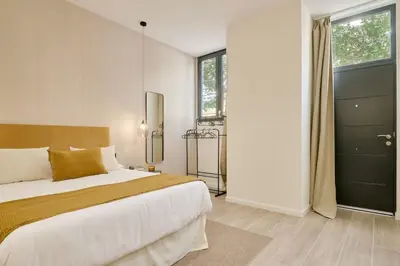 a bedroom with a large bed and a large window at Romantic Apartment N5 Oceanografico Virkin Suites in Valencia