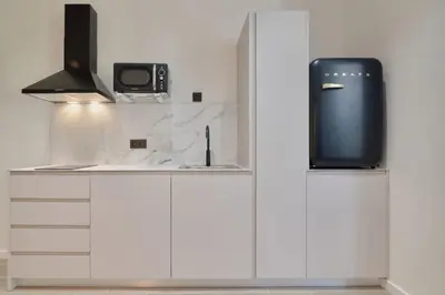 a microwave sitting on top of a kitchen counter at Romantic Apartment N6 Oceanografico Virkin Suites in Valencia