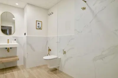 a bathroom with a shower and a toilet and a sink at Romantic Apartment N6 Oceanografico Virkin Suites in Valencia