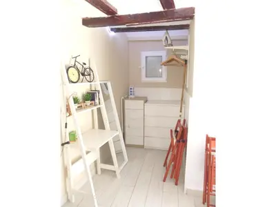 a room with white ladders and a room with a shelf at Loft bajo vivienda centro de Valencia-Carmen in Valencia