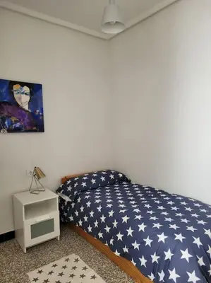 a bedroom with a bed with an american flag bedspread at Bella Morvedre in Sagunto