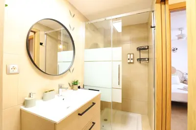 a bathroom with a sink and a mirror at Tranquilo y delicioso rincón junto al mar in Puerto de Sagunto