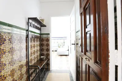 a hallway with colorful tiles on the walls at Tradición y modernidad Casa de pueblo junto al mar in Puerto de Sagunto