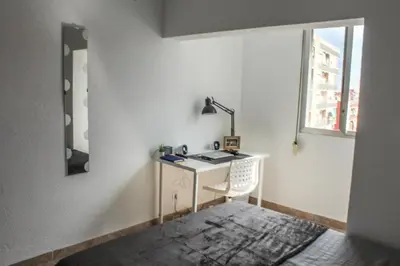 a desk in a room with a mirror and a window at Flat close to beach perfect for families and groups - Actor Mauri 18 in Valencia