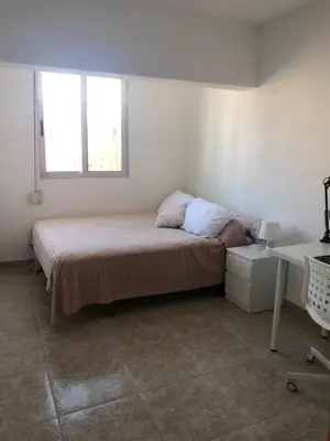a bedroom with a bed and a window at Flat close to beach perfect for families and groups - Actor Mauri 18 in Valencia