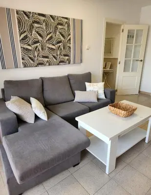 a living room with a couch and a coffee table at Apartamento Premium frente al mar, en primera linea de playa in Cullera