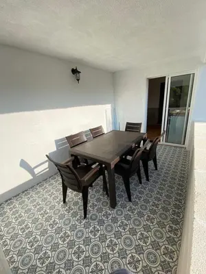 a dining room with a table and some chairs at Rey Elzinga in Godelleta
