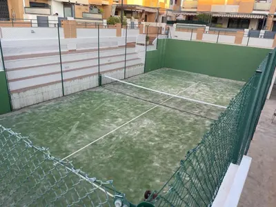 an overhead view of a tennis court on a building at Valencia Sun House in Puebla de Farnals