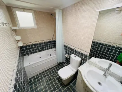 a bathroom with a sink and a toilet and a tub at ISABEL Apartment in Puerto de Sagunto