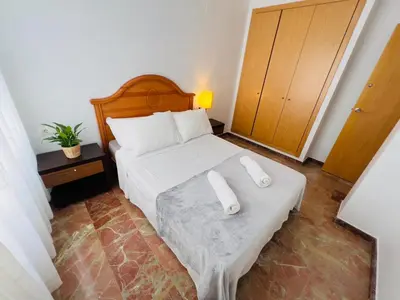a bedroom with a bed with two pillows on it at ISABEL Apartment in Puerto de Sagunto