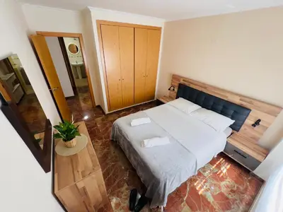 a bedroom with a large bed in a room at ISABEL Apartment in Puerto de Sagunto