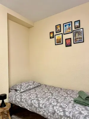 a bedroom with a bed and pictures on the wall at Cozy Flat with City & Beach in Puerto de Sagunto