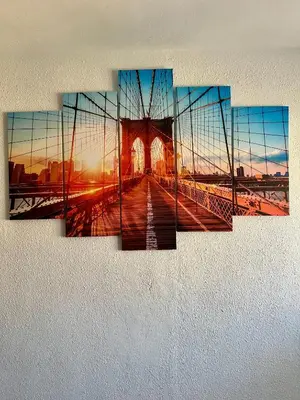 a painting of a bridge with the sunset at Cozy Flat with City & Beach in Puerto de Sagunto