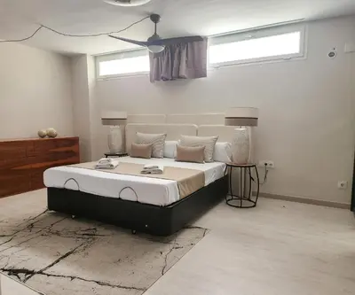 a bedroom with a large bed in a room at MD Malva Valterna in Paterna