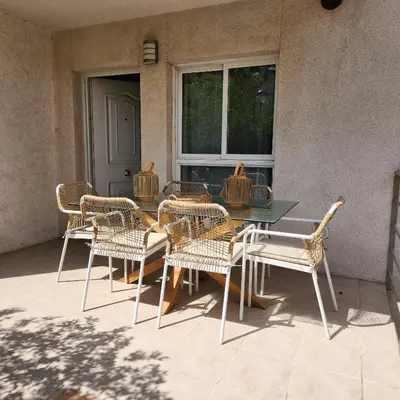 a group of chairs and a table on a patio at MD Malva Valterna in Paterna