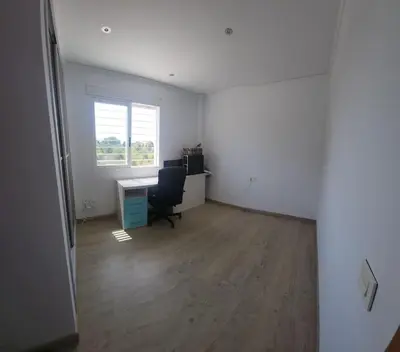 an empty room with a desk and a chair at Casa Villa Molins in Valencia