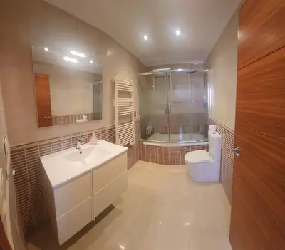a bathroom with a sink and a toilet and a tub at Casa Villa Molins in Valencia