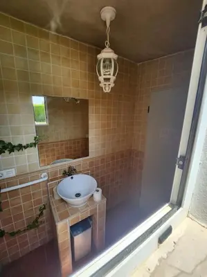 a bathroom with a sink and a mirror at Casa Villa Molins in Valencia