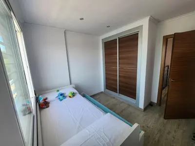 a room with a bed and a sliding glass door at Casa Villa Molins in Valencia