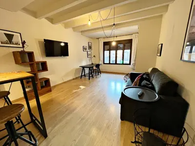 a living room with a couch and a table at Apartamento junto Mercado Central Valencia in Valencia