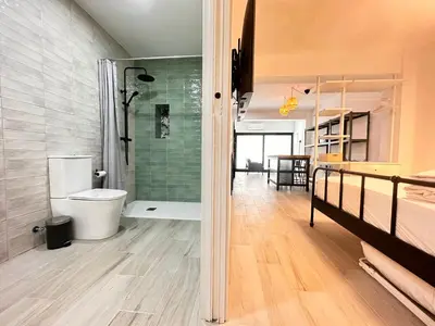 a bathroom with a shower and a toilet in a room at Alberola Industrial Style in Valencia
