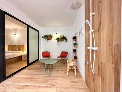 a room with a table and two chairs and a bed at Valencia & Suites Ayora in Valencia