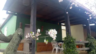 a house with a table and chairs in front of it at La Traviesa in Soneja