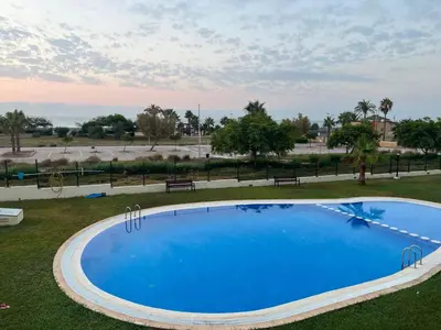a large blue swimming pool in a park at Almenara, primera linea de playa VT-45077-CS in Almenara