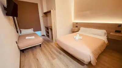 a bedroom with a bed with two candles on it at OPTIMUS COMFORT Campoamor 101 in Valencia