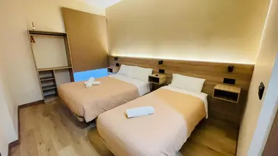 a small room with two beds in it at OPTIMUS COMFORT Campoamor 101 in Valencia