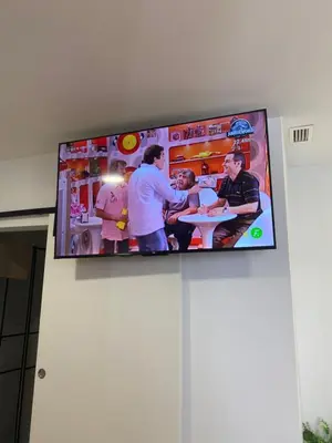 a flat screen tv hanging on a wall at ALZIRA BONiTA LES BARRAQUES LOFT in Alzira